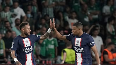 Kylian Mbappe, right, looks to have reached an agreement to stay at Paris Saint-Germain this season, while Neymar is heading for Saudi Arabia. AP
