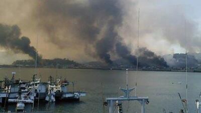 South Korea's Yeonpueong Island is engulfed in thick smoke as North Korea reportedly fired hundreds of rounds of artillery from its stronghold on the west coast.