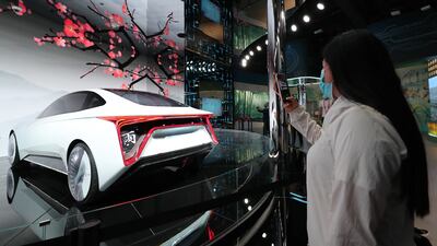 A visitor looks at the Saic Kun concept car, on display in the Chinese pavilion. Photo: EPA