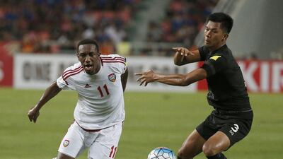 UAE striker Ahmed Khalil, left, and Thailand's Pansa Hemviboon battle for the ball during their 2018 World Cup qualifier at Rajamangala Stadium in Bangkok, Thailand, Tuesday, June 13, 2017. Sakchai Lalit / AP Photo