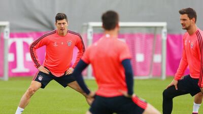 Robert Lewandowski (L) stretches with teammates during a FC Bayern Munich training session ahead of their Uefa Champions League semi-final second leg match against Atletico Madrid at the Sabener Strasse training ground on May 2, 2016 in Munich, Germany. (Photo by Alexander Hassenstein/Bongarts/Getty Images)