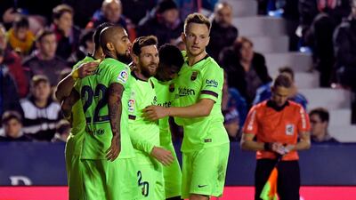 Lionel Messi celebrates a goal with teammates. AFP
