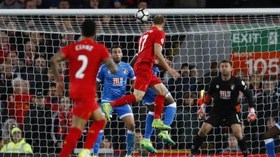 Liverpool's Ragnar Klavan shoots at goal as Bournemouth's Artur Boruc looks on. Jason Cairnduff / Reuters