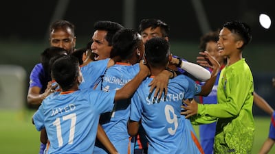 Player of Minerva Academy celebrate winning the U12 Mina Cup final.