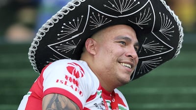 A fan watches the game between Samoa and Canada at The Sevens Stadium in Dubai. Chris Whiteoak / The National