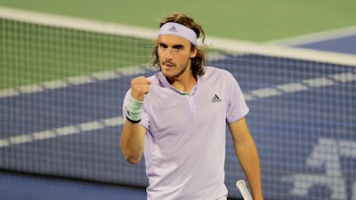 Stefanos Tsitsipas celebrates winning a point. Reuters