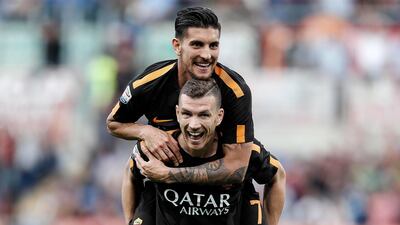 Roma's Edin Dzeko, bottom, has scored some important goals to help his team overturn deficits in this season's Champions League. Riccardo Antimiani / AP Photo