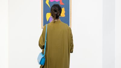 The artist began with a palette for a background and then cut shapes out of different craft paper, piecing them together intuitively. Pictured: Self Love-NVY II