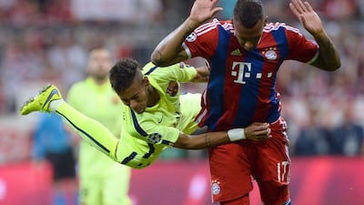 Bayern Munich's Jerome Boateng clashes with Barcelona's Neymar during their Champions League contest on Tuesday night. Andreas Gebert / EPA