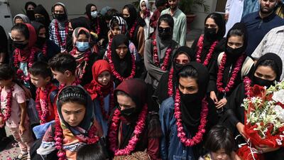 Young Afghan footballers were given floral garlands after arriving in Lahore, Pakistan, a month after the Taliban took power in Afghanistan. AFP