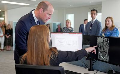 Prince William talks to a researcher as he visits The Royal Marsden NHS Foundation Trust's Oak Cancer Centre. AFP