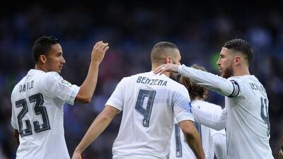 Sergio Ramos of Real Madrid, right, congratulates Karim Benzema after one of his goals against Rayo Vallecano on Sunday. Denis Doyle / Getty Images / December 20, 2015