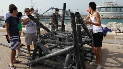 School children build an artifical reef project as part as Ecocoast education on Tuesday at the diving club at Jumeria beach hotel in Dubai.