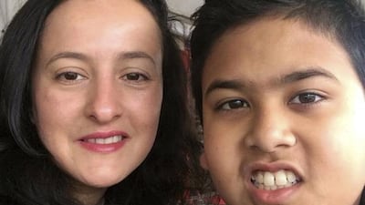 In this undated photo released by the Calehr family, Miguel Panduwinata, right, poses with his mother Samira Calehr. Miguel and his brother Shaka Panduwinata were killed aboard Malaysia Airlines Flight 17, which was shot down over eastern Ukraine. The Calehr family/AP Photo