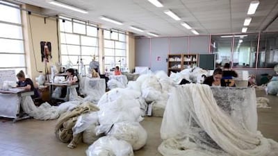 Bundles of lace are checked and hand finished at the Sophie Hallette lace making factory.