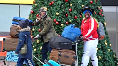Passengers walk through the South Terminal building. Reuters