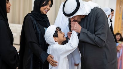 President Sheikh Mohamed greets a foster child from the Family Care Authority during a special ceremony at Qasr Al Bahr in Abu Dhabi. All photos: UAE Presidential Court