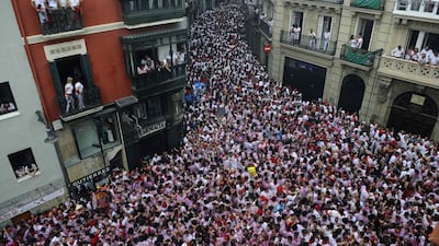 People cheer after hearing the midday “Chupinazo” rocket announcing the start of the San Fermin festival in Pamplona. Vincent West / Reuters