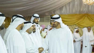 Sheikh Mohammed bin Zayed, Crown Prince of Abu Dhabi and Deputy Supreme Commander of the Armed Forces, greets a guest while offering condolences to the family of Mohamed Nasser Al Dhaheri, who died when his military helicopter crashed during a routine flight over international waters. Rashed Al Mansoori / Crown Prince Court — Abu Dhabi