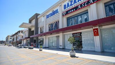 Closed shops in the Lara district in Antalya last month, which is usually busy with tourists. Tourism generates about 11 per cent of Turkey's GDP, but the industry has been hit by a lack of travellers as a result of the Covid-19 pandemic. AFP