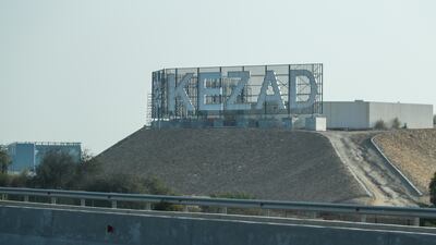 Five people were injured by debris after an Iranian missile was intercepted and two fires erupted in the vicinity of the Kezad area of Abu Dhabi on Saturday. Victor Besa / The National