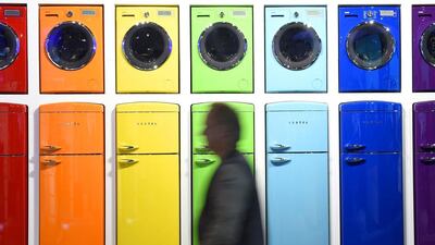 A man walks past an installation with refrigerators and washing machines at the booth of Vestel at IFA in Berlin. Tobias Schwarz / AFP