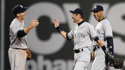 New York Yankees right fielder Ichiro Suzuki, centre, with his teammates. CJ Gunther / EPA