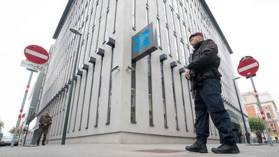 Austrian policemen guard entrance to the Opec headquarters in Vienna where ministers are due to meet next week amid calls for an extension to oil production cuts. Joe Klamer / AFP