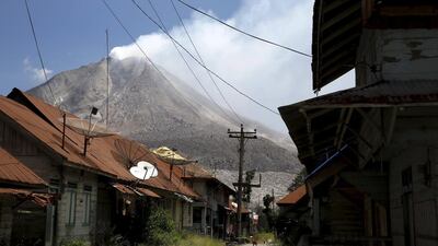 An empty village is seen inside the danger zone on the slope of Mount Sinabung volcano at Beras Tepu Village in Karo Regency, in North Sumatra province,. More than 10,000 people from 12 villages, who are living around the slopes of Mount Sinabung, have left their homes and moved to refugee camps, local media said. Beawiharta/Reuters