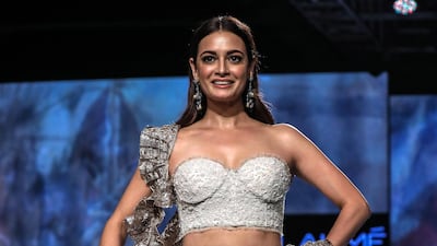 Bollywood actress Dia Mirza presents a creation by Indian designers Sama, Meera and Muzaffar Ali during Lakme Fashion Week in Mumbai, EPA