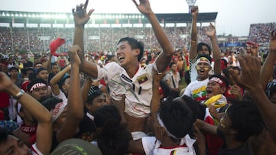 Than Paing of the Myanmar Under-19 national football team is lifted into the air by fans after their win over the UAE in the quarter-finals of the AFC Under-19 Championships on Friday. Ye Aung Thu / AFP / October 17, 2014