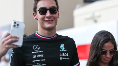 George Russell of Mercedes arrives with girlfriend Carmen Montero at Marina Circuit on the final day of the Abu Dhabi Grand Prix 2022. Victor Besa / The National