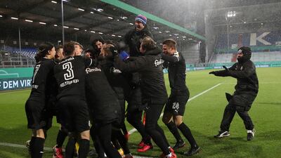 Kiel's players celebrate after beating Bayern Munich. AP