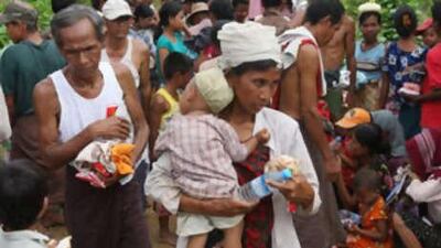 People receiving food aid in May in Dedaye, some 130km south-west of Yangon.