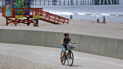 A bicyclist rides along a bike path in the Venice Beach neighborhood of Los Angeles, California. These are the kind of neighbours Rob Long can tolerate. (Photographer: Jonathan Alcorn/Bloomberg)