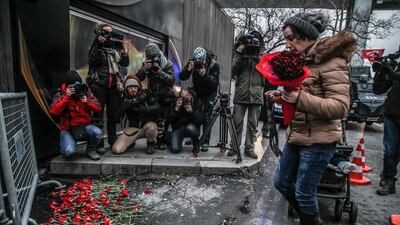 A woman places flowers outside the Reina nightclub by the Bosphorus, following the gun attack on New Year's Eve. Daghan Kozanoglu / Getty Images