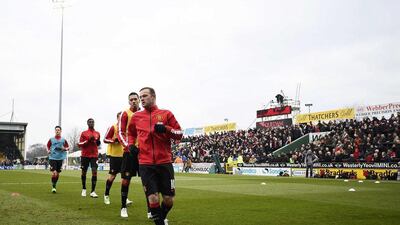 Manchester United players warm up before their FA Cup third round match against Yeovil Town on Sunday, which they won. Dylan Martinez / Reuters/ January 4, 2015