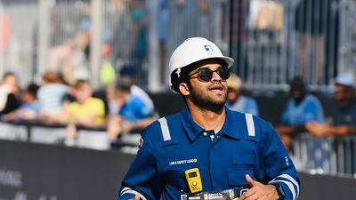 Sadique Ahmed ran the Abu Dhabi marathon on Saturday while wearing workwear to raise awareness about health and safety in the workplace. Photo: Sadique Ahmed