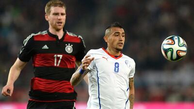 Arturo Vidal and Chile lost to Germany 1-0. They'll play in Group B at the 2014 World Cup with Spain, Netherlands and Australia. Patrik Stollarz / AFP