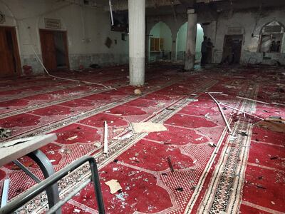 Debris inside the mosque in Peshawar, where at least 45 people were killed in a bomb blast. EPA