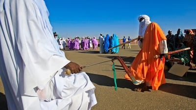 Displaced Sudanese welcome Sudan's prime minister in El-Fasher, the capital of the North Darfur state. AFP