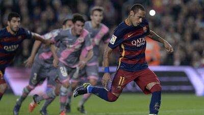 Barcelona’s Neymar attempts the penalty and converts, one of his two spot kick scores on Saturday night against Rayo Vallecano in La Liga. Josep Lago / AFP