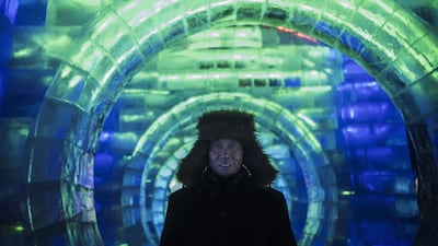A Chinese labourer pauses in a large ice sculpture while working in preparation for the Harbin Ice and Snow Festival. Getty Images