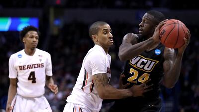 OKLAHOMA CITY, OKLAHOMA - MARCH 18: Korey Billbury #24 of the Virginia Commonwealth Rams with the ball against Gary Payton II #1 of the Oregon State Beavers in the second half in the first round of the 2016 NCAA Men's Basketball Tournament at Chesapeake Energy Arena on March 18, 2016 in Oklahoma City, Oklahoma. Ronald Martinez/Getty Images/AFP== FOR NEWSPAPERS, INTERNET, TELCOS & TELEVISION USE ONLY ==