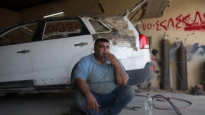 Ali Shaikhi, aged 33, smokes at work in Bahirka town, 8km north of Erbil, the capital of the Kurdistan Region, Iraq. Shaikhi fled from his Syrian hometown of Kobane to Erbil in 2012. His house was destroyed by the so-called 'Islamic State' (IS), also known as 'Isis,' when they attacked the city in northern Syria in 2014. He now works as a vehicle body repairer and has five children. Some 245,810 registered Syrian refugees live in the Kurdistan Region, according to the UNHCR. Many of them have a job, open shops, restaurants, or barbershops. World Refugee Day is marked annually on 20 June. According to the UNHCR, more and more refugees today live in urban settings outside refugee camps. EPA