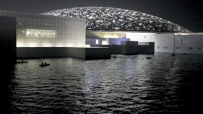 Kayakers float in the waters around Louvre Abu Dhabi. Chris Whiteoak / The National