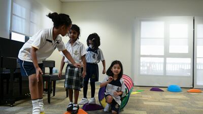Grade 1 pupils tackle an obstacle course.