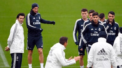 Santiago Solari watches on as his coaching staff give instructions to Real Madrid players. AFP