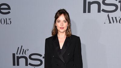 Dakota Johnson wore a Louis Vuitton tuxedo to attend the InStyle Awards at the Getty Centre on October 26, 2015 in Los Angeles, California. Getty Images