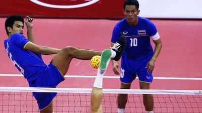 Thailand's Sahachat Sakhoncharoen, left, attempts to block a strike by South Korea's Kim Young-man during their men's team sepak takraw game at the Bucheon Gymnasium during the Asian Games in Incheon, South Korea, on September 23, 2014. Jason Reed / Reuters
